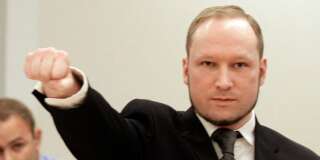 Mass murderer Anders Behring Breivik, makes a salute after  he arrives at the court room in a courthouse in Oslo  Friday Aug. 24, 2012 . Breivik has been declared sane and sentenced to prison for bomb and gun attacks that killed 77 people last year. (AP Photo/Frank Augstein)