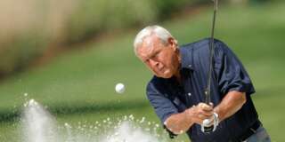 Former champion Arnold Palmer of the U.S hits from a sand trap during the annual Masters Par 3 golf tournament at the Augusta National Golf Club in Augusta, Georgia, April 9, 2008.      REUTERS/Hans Deryk/File Photo