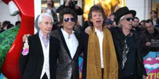Members of the band The Rolling Stones, from left, Charlie Watts, Ronnie Wood, Mick Jagger and Keith Richards pose for photographers upon arrival at the Rolling Stones Exhibitionism preview in London, Monday, April 4, 2016. (Photo by Joel Ryan/Invision/AP)