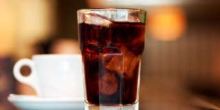 a glass of cola or soda with...