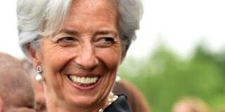 International Monetary Fund Managing Director Christine Lagarde shares a joke prior to the gala dinner in the honor of the French navy frigate L'Hermione at Mount Vernon, Virginia on June 09, 2015. A replica of L'Hermione which brought General Lafayette to America to rally rebels fighting Britain in the US war of independence, arrived in the United States again, 235 years after the original crossing.   AFP PHOTO/MLADEN ANTONOV/POOL