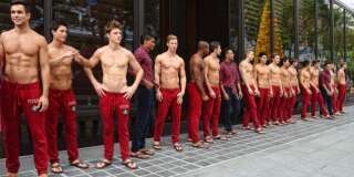 The shirtless Abercrombie and Fitch models posed in front of the American fashion chain's flagship store at Kightsbridge, Orchard Road to advertise that this retail store will be opened for business on 15 December 2011,