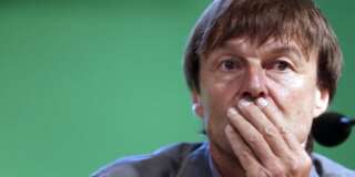French TV host and environmental campaigner Nicolas Hulot listens during a press conference, on June 27, 2012, at the headquarters of France's Economic, Social and Environmental Council (CESE) in Paris, to launch a campaign of French NGOs called 'Urges End to Fossil Fuel Subsidies', headed by the Nicolas Hulot Foundation and the Climate Action Network France (RAC-F). AFP PHOTO KENZO TRIBOUILLARD        (Photo credit should read KENZO TRIBOUILLARD/AFP/GettyImages)