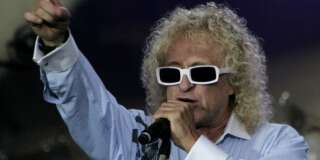 French singer Michel Polnareff sings during his concert as part of Bastille Day celebration at the Eiffel Tower in Paris, France, Saturday, July 14, 2007. (AP Photo/Michel Euler, Pool)