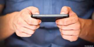 close up of a man using mobile...