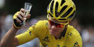 Britain's Chris Froome, wearing the overall leader's yellow jersey, celebrates with a glass of champagne during the twenty-first stage of the Tour de France cycling race over 113 kilometers (70.2 miles) with start in Chantilly and finish in Paris, France, Sunday, July 24, 2016. (Keno Tribouillard via AP Photo)