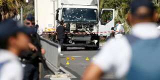 French police secure the area as the investigation continues at the scene near the heavy truck that ran into a crowd at high speed killing scores who were celebrating the Bastille Day July 14 national holiday on the Promenade des Anglais in Nice, France, July 15, 2016.    REUTERS/Eric Gaillard