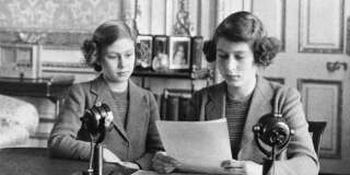 In her first radio broadcast, 14-year-old Princess Elizabeth, right, said that England's children at home were full of cheerfulness and courage. She is shown with her younger sister, Princess Margaret Rose, before the broadcast, in London on Oct. 13, 1940. (AP Photo)