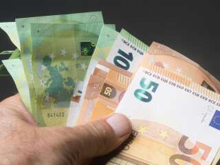 Man Holding Euro Banknotes - Cash Money