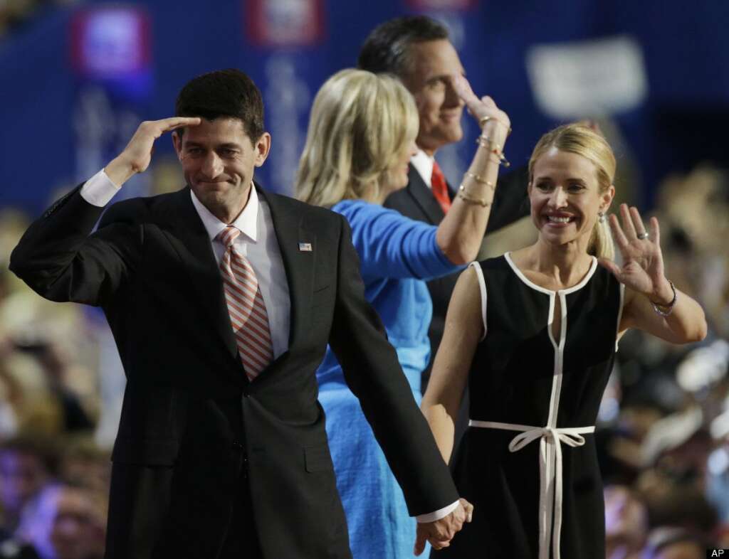 Republican vice presidential nominee, Rep. Paul Ryan and his wife Janna salute delegates following Republican presidential nominee Mitt Romney's speech during the Republican National Convention in Tampa, Fla., on Thursday, Aug. 30, 2012. Behind is Mitt Romney and his wife Ann. (AP Photo/Charlie Neibergall)