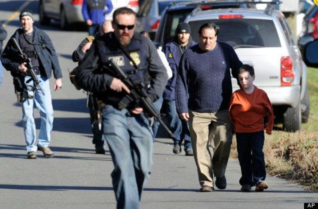 Sandy Hook Elementary School Shooting - Parents leave a staging area after being reunited with their children following a shooting at the Sandy Hook Elementary School in Newtown, Conn.