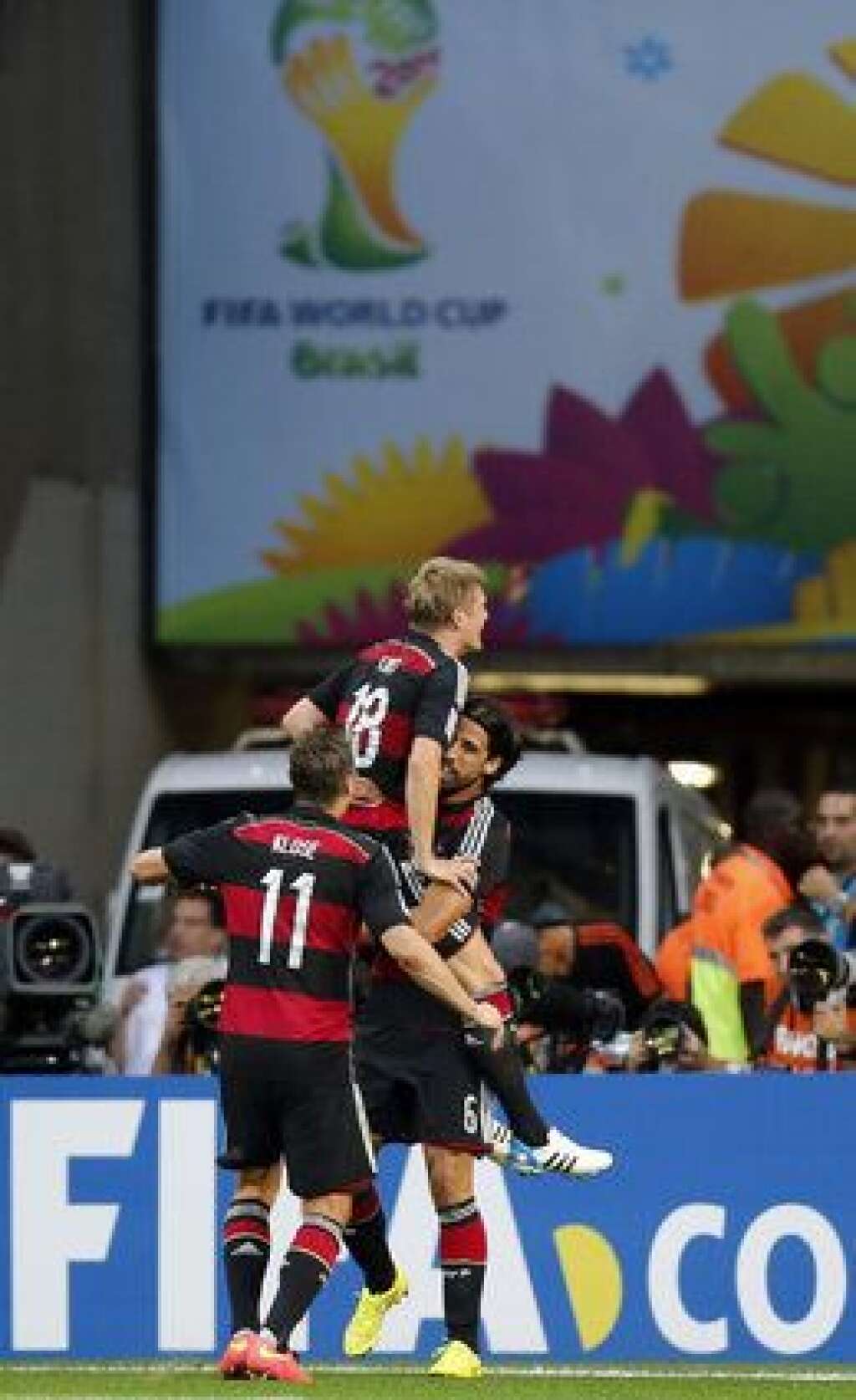 Brazil Soccer WCup Brazil Germany - Germany's Miroslav Klose, Toni Kroos and Sami Khedira, from left, celebrate after scoring during the World Cup semifinal soccer match between Brazil and Germany at the Mineirao Stadium in Belo Horizonte, Brazil, Tuesday, July 8, 2014. (AP Photo/Frank Augstein)