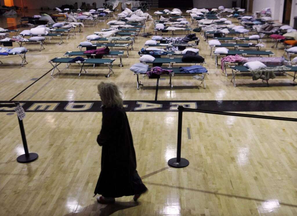 - A person walks through a makeshift shelter in a gymnasium at Toms River East High School as they arrive to vote Tuesday, Nov. 6, 2012, in Toms River, N.J. N.J. Voter turnout was heavy in several storm-ravaged Jersey Shore towns, with many voters expressing relief and even elation at being able to vote at all, considering the devastation. (AP Photo/Mel Evans)
