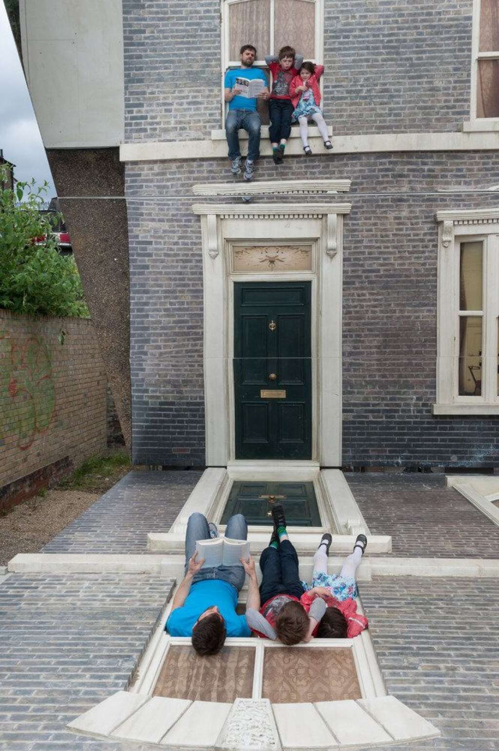 Leandro Erlich Dalston House - Visitors play with illusion Leandro Erlich: Dalston House Installation images © Gar Powell-Evans 2013 Courtesy of <a href="http://www.barbican.org.uk/" target="_blank">Barbican Art Gallery</a>