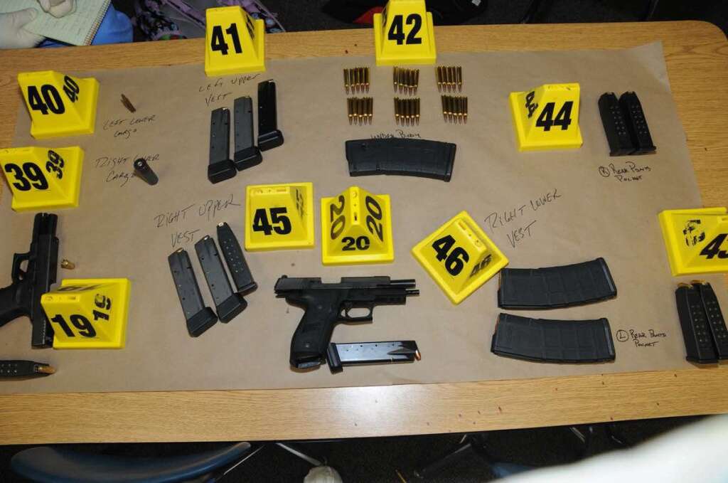 Second Report On Sandy Hook Shootings Released - NEWTOWN, CT - UNSPECIFED DATE: In this handout crime scene evidence photo provided by the Connecticut State Police, shows firearms and ammunition found on or in close proximity to shooters body at Sandy Hook Elementary School following the December 14, 2012 shooting rampage, taken on an unspecified date in Newtown, Connecticut. A second report was released December 27, 2013 by Connecticut State Attorney Stephen Sedensky III gave more details of the the Newtown school shooting by Adam Lanza that left 20 children and six women educators dead inside Sandy Hook Elementary School after killing his mother at their home.  (Photo by Connecticut State Police via Getty Images)