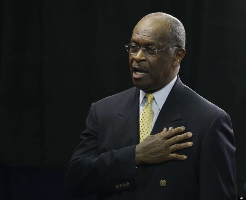 Herman Cain recites the Pledge of Allegiance during the Republican National Convention in Tampa, Fla., on Thursday, Aug. 30, 2012. (AP Photo/Charlie Neibergall)