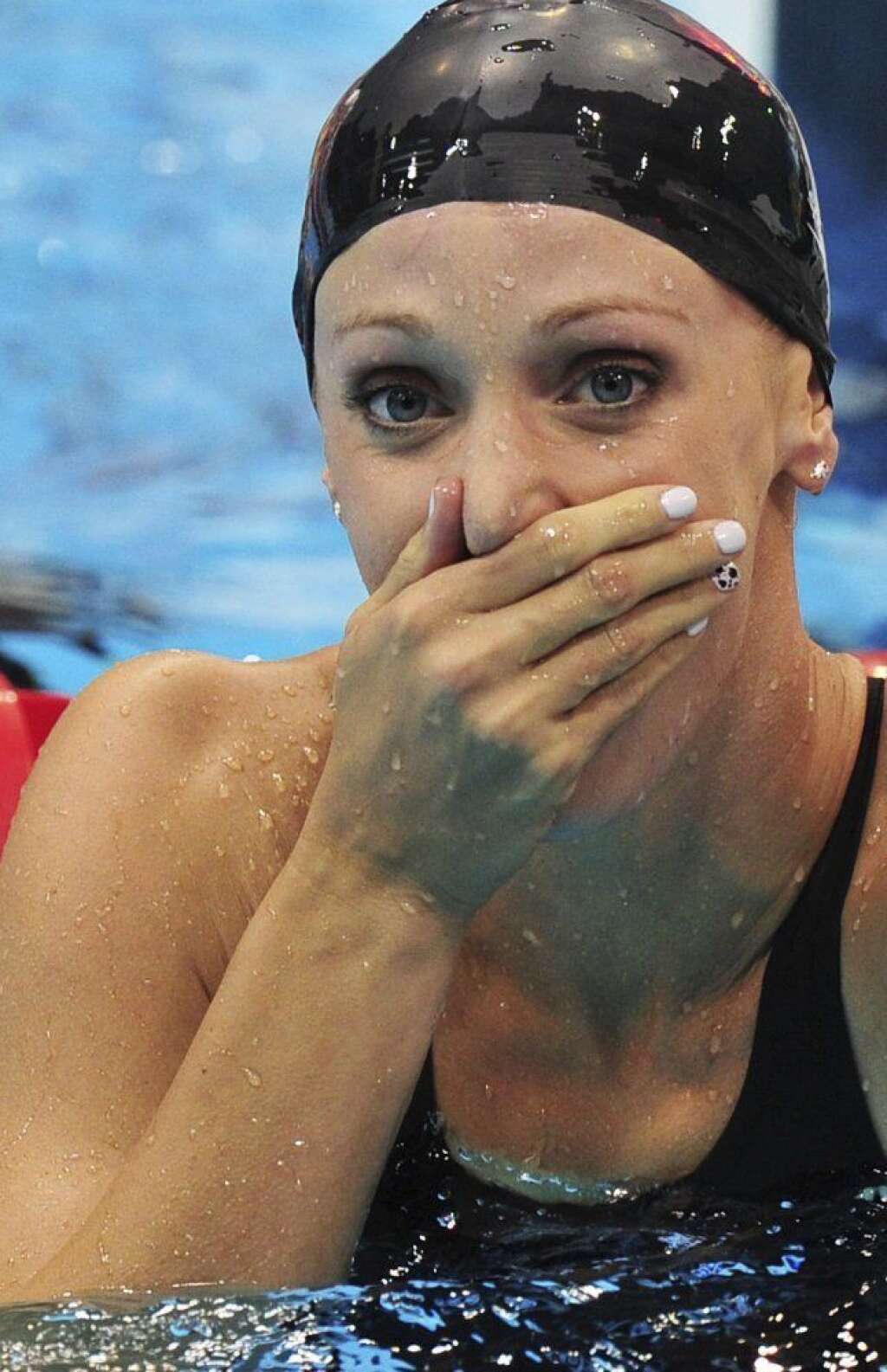 La estadounidense Dana Vollmer, oro y nuevo récord olímpico en los 100 metros mariposa. -