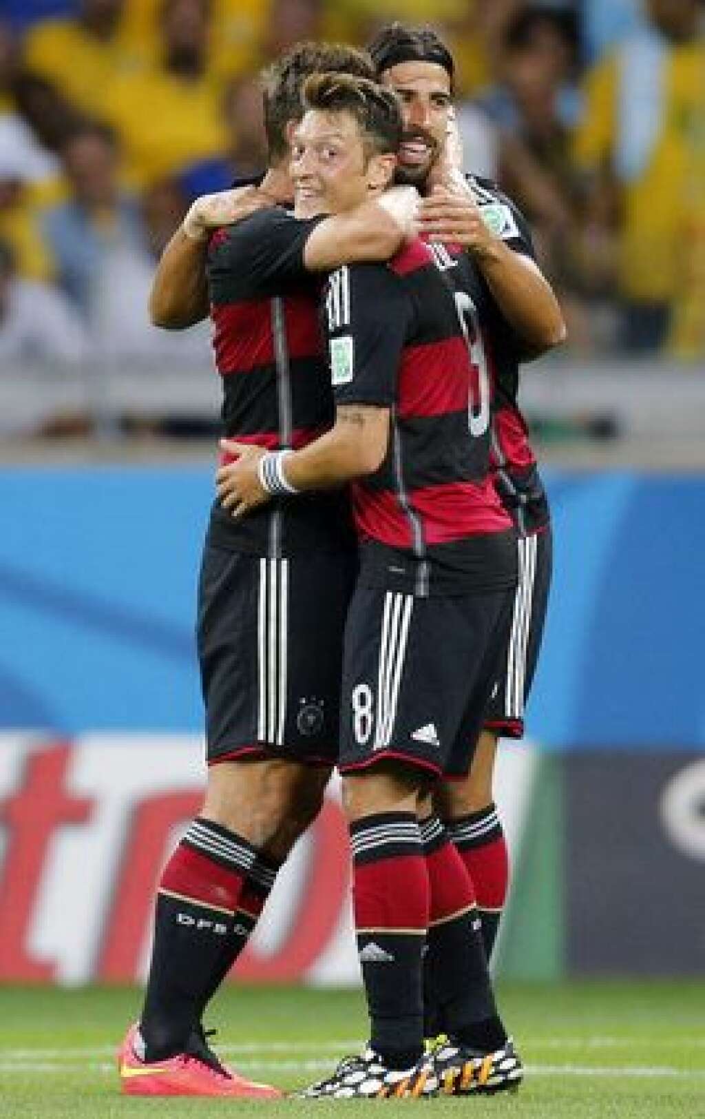Brazil Soccer WCup Brazil Germany - Germany's Miroslav Klose, Mesut Ozil and Sami Khedira, from left, celebrate after scoring during the World Cup semifinal soccer match between Brazil and Germany at the Mineirao Stadium in Belo Horizonte, Brazil, Tuesday, July 8, 2014. (AP Photo/Frank Augstein)