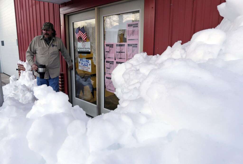 - Snow surrounds the polling precinct in Terra Alta, W.Va., as Peter Hough heads to work after casting his ballot on Election Day, Tuesday, Nov. 6, 2012. (AP Photo/Dave Martin)