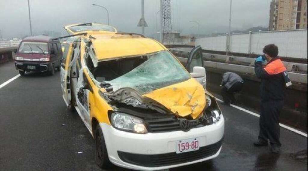 A taxi that was hit by the Taiwanese flight with 58 people aboard then crashed into the river