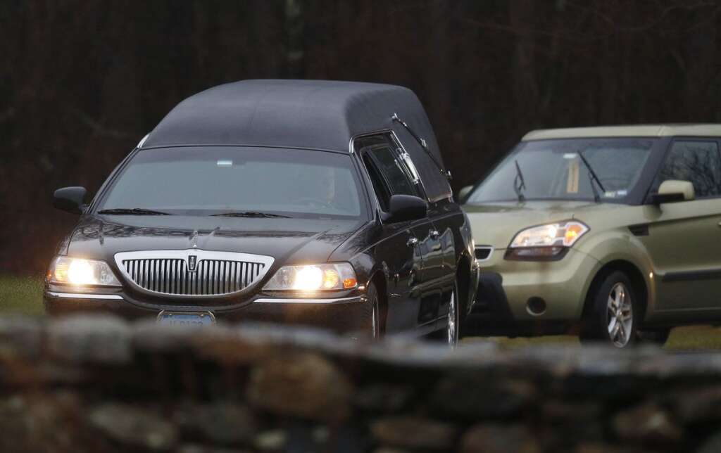 - A hearse arrives at B'nai Israel Cemetery with the body of Noah Pozner, a six-year-old killed in an elementary school shooting, during funeral services, Monday, Dec. 17, 2012, in Monroe, Conn. Authorities say gunman Adam Lanza killed his mother at their home on Friday and then opened fire inside the Sandy Hook Elementary School in Newtown, killing 26 people, including 20 children, before taking his own life. (AP Photo/Julio Cortez)