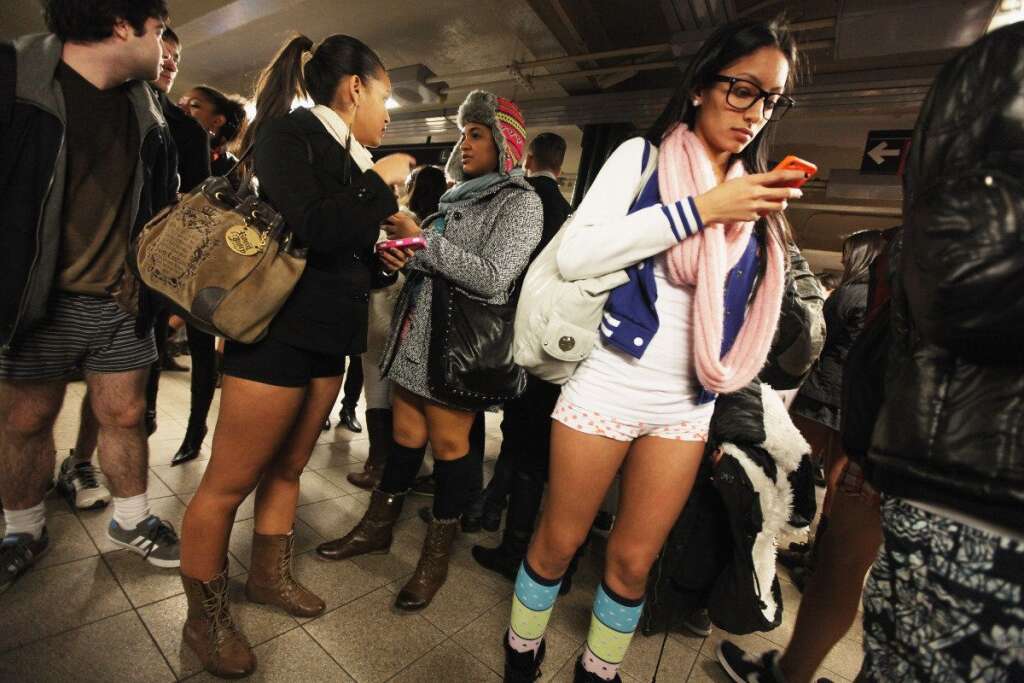 No Pants Subway Ride - Alyssa Pabon checks her phone in the Union Square subway station during the annual No Pants Subway Ride on Jan. 8, 2012 in New York City.  The annual event is staged by the group Improv Everywhere which encourages people in dozens of cities worldwide to discard their pants while riding the subway. (Mario Tama, Getty Images)