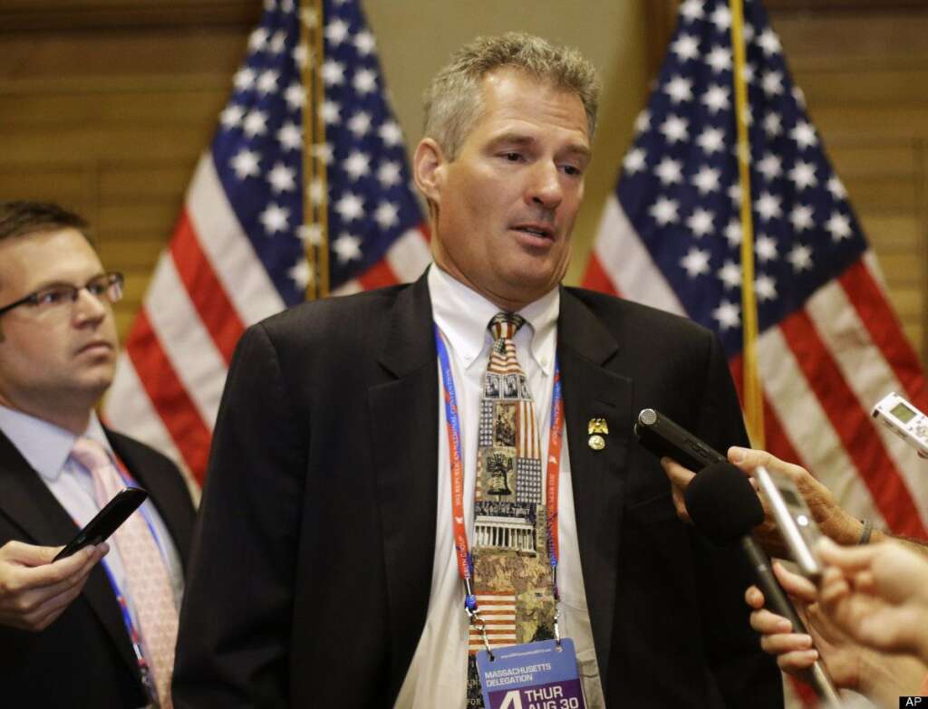 Senator Scott Brown, R-Mass., answers questions during a press conference in Tampa, Fla., on Thursday, Aug. 30, 2012. (AP Photo/Patrick Semansky)