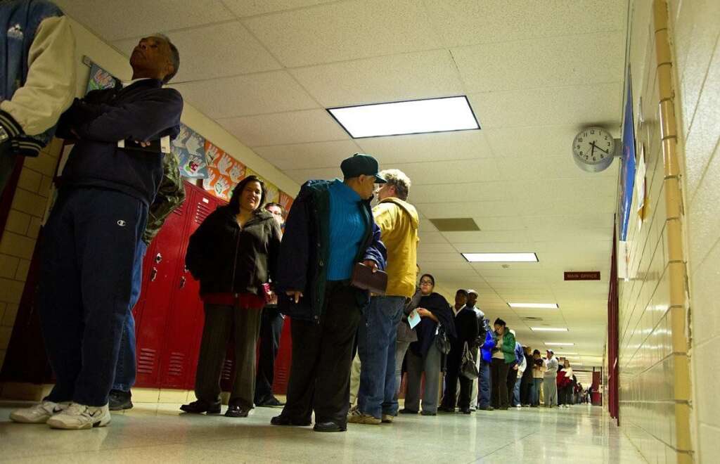 US-VOTE-2012-ELECTION-VOTERS - This photo shows about half of the line waiting to vote, only some twenty minutes into the voting day at the Stonewall Middle School November 6, 2012 in Manassas, Prince William County, Virginia. After a long and bitter White House campaign, Americans began casting their votes on Tuesday with polls showing President Barack Obama and Republican challenger Mitt Romney neck-and-neck in an election that will be decided in a handful of states. AFP PHOTO/Karen BLEIER        (Photo credit should read KAREN BLEIER/AFP/Getty Images)