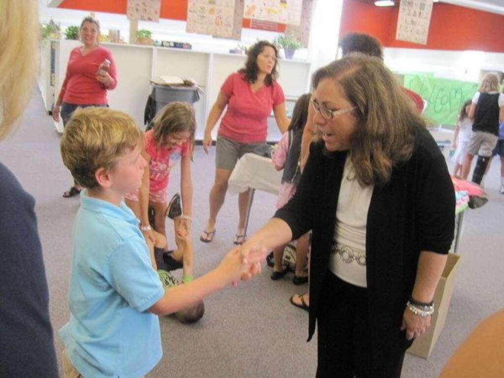 Sandy Hook Elementary School Shooting - A scene from Sandy Hook Elementary School has been confirmed as killed in the shooting.  Photo from: https://twitter.com/DHochsprung  <strong>CORRECTION:</strong> A previous caption suggested that the woman in this photo is Dawn Hochsprung. She is not Dawn Hochsprung.