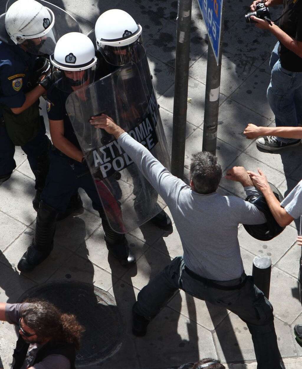 - Protesters clash with riot police in Athens, during a 24-hour nationwide general strike on Thursday, Oct. 18, 2012. Greece was facing its second general strike in a month Thursday as workers protested over another batch of austerity measures that are designed to prevent the bankruptcy of the country. (AP Photo/Thanassis Stavrakis)