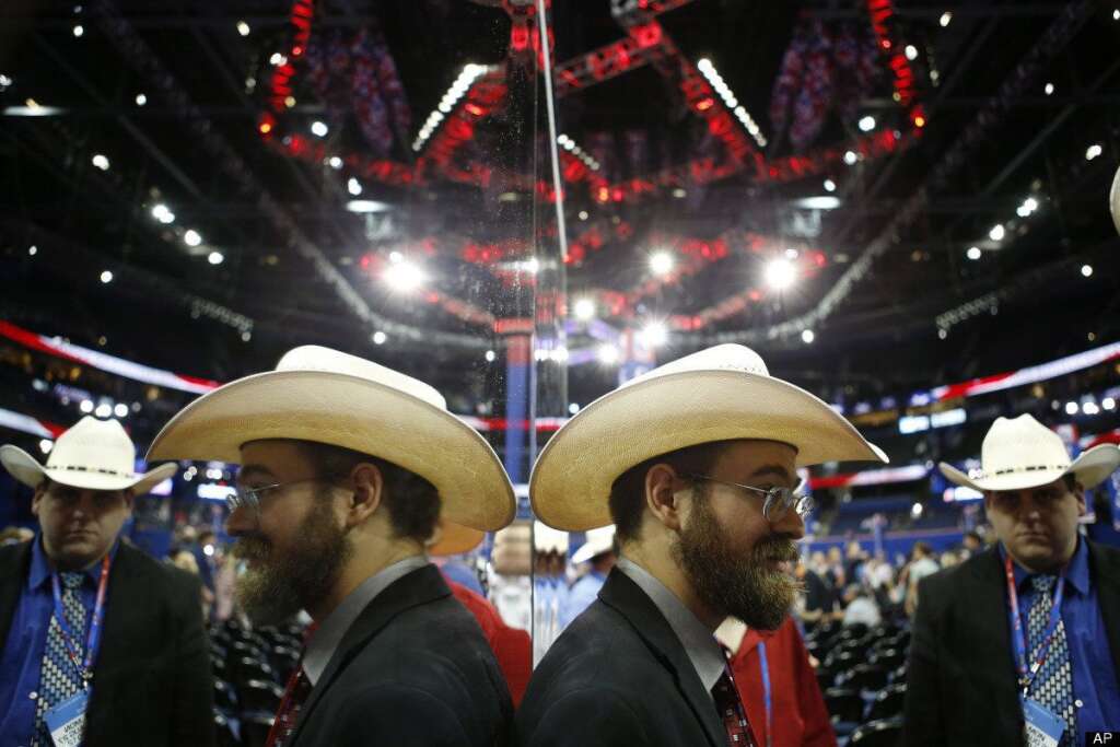 Jeremy Blosser - Jeremy Blosser from Ft. Worth, Texas stands next a mirrored wall on the convention floor after an abbreviated session of the Republican National Convention in Tampa, Fla., on Monday, Aug. 27, 2012. (AP Photo/Jae C. Hong)