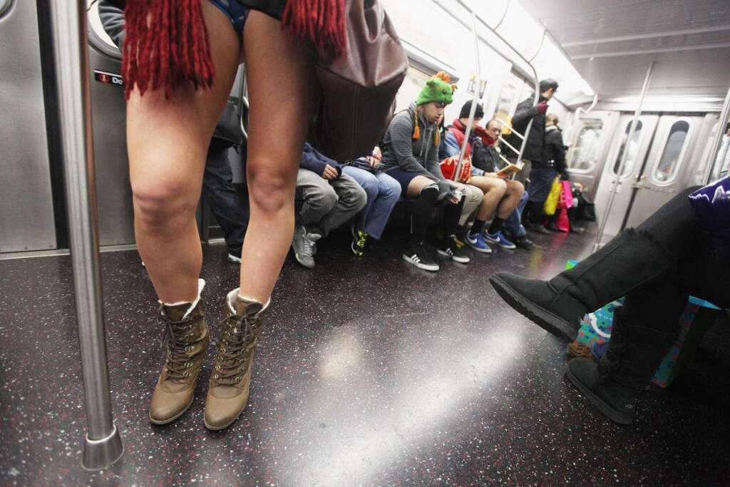 No Pants Subway Ride - A participant rides the subway during the annual No Pants Subway Ride on Jan. 8, 2012 in New York City. The annual event is staged by the group Improv Everywhere which encourages people in dozens of cities worldwide to discard their pants while riding the subway. (Mario Tama, Getty Images)