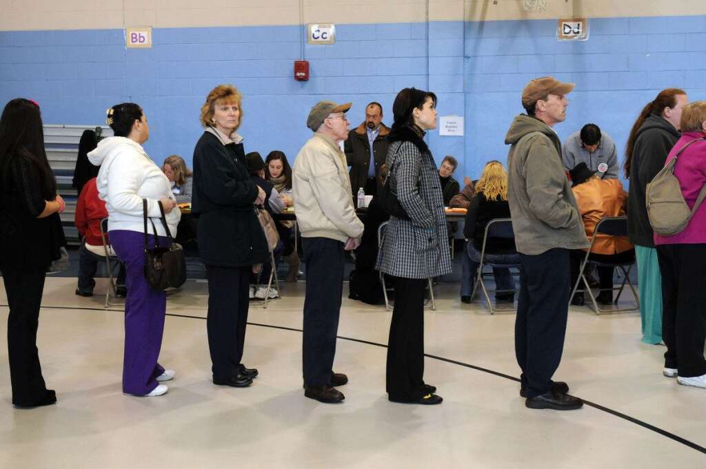 U.S. Citizens Head To The Polls To Vote In Presidential Election - MANCHESTER, NH - NOVEMBER 6:  Voters cast their ballots at the Bishop Leo O'Neil Youth Center on November 6, 2012 in Manchester, New Hampshire. The swing state of New Hampshire is recognised to be a hotly contested battleground that offers 4 electoral votes, as recent polls predict that the race between U.S. President Barack Obama and Republican presidential candidate Mitt Romney remains tight.  (Photo by Darren McCollester/Getty Images)