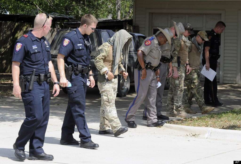 - Law enforcement officials conduct a grid search of an area where police say a gunman was being served an eviction notice when he opened fire from inside a home near Texas A&M and killed a law enforcement officer Monday, Aug. 13, 2012, in College Station, Texas. Three people, including the gunman, were killed in the shootout. (AP Photo/Pat Sullivan)