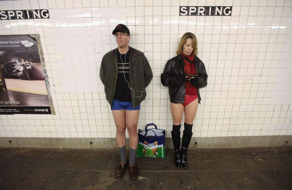 No Pants Subway Ride - Participants wait for their train during the annual No Pants Subway Ride on Jan. 8, 2012 in New York City. The annual event is staged by the group Improv Everywhere which encourages people in dozens of cities worldwide to discard their pants while riding the subway. (Mario Tama, Getty Images)