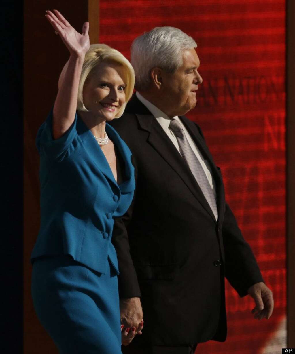 Former House Speaker Newt Gingrich and his wife Callista walk onto the stage to speak to delegates during the Republican National Convention in Tampa, Fla., on Thursday, Aug. 30, 2012. (AP Photo/Charlie Neibergall)