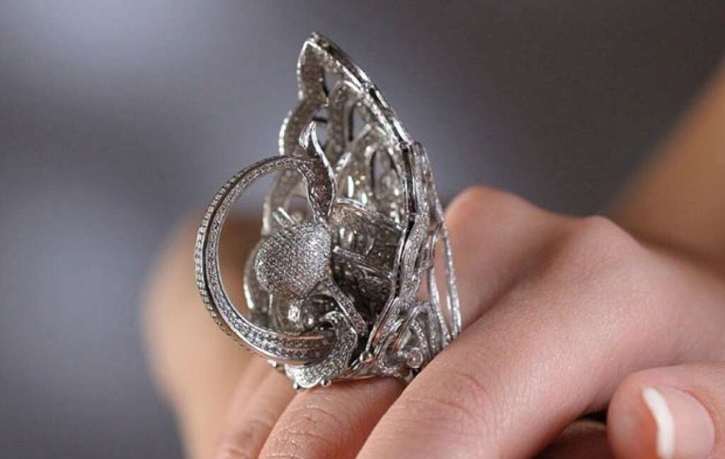 Most Diamonds Set In One Ring - The Lobortas Classic Jewelry House in Ukraine created this record-setting ring -- the "Tsarevna Swan" -- containing an incredible 2,525 cut diamonds.