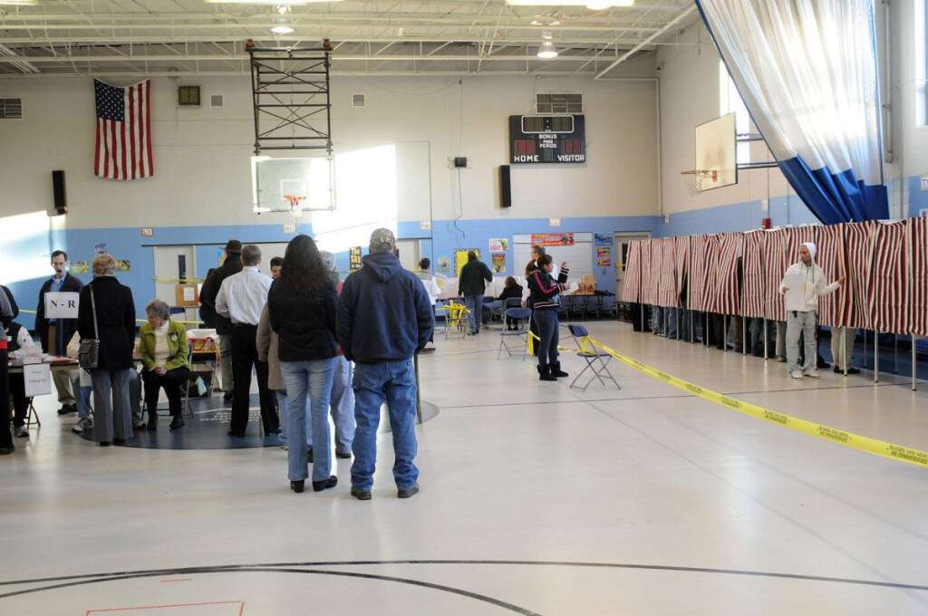 U.S. Citizens Head To The Polls To Vote In Presidential Election - MANCHESTER, NH - NOVEMBER 6: Voters cast their ballots at the Bishop Leo O'Neil Youth Center on November 6, 2012 in Manchester, New Hampshire. The swing state of New Hampshire is recognised to be a hotly contested battleground that offers 4 electoral votes, as recent polls predict that the race between U.S. President Barack Obama and Republican presidential candidate Mitt Romney remains tight.  (Photo by Darren McCollester/Getty Images)