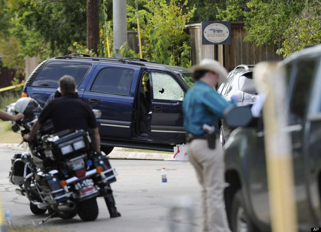 - Law enforcement officials investigate an area where police say a gunman was being served an eviction notice when he opened fire from inside a home near Texas A&M and killed a law enforcement officer Monday, Aug. 13, 2012, in College Station, Texas. Three people, including the gunman, were killed in the shootout. (AP Photo/Pat Sullivan)