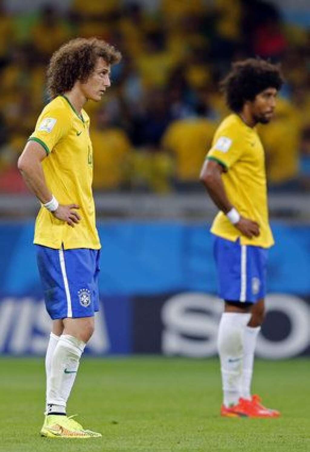 Brazil Soccer WCup Brazil Germany - Brazil's David Luiz, left, and Dante react after Germany scored their sixth goal during the World Cup semifinal soccer match between Brazil and Germany at the Mineirao Stadium in Belo Horizonte, Brazil, Tuesday, July 8, 2014. (AP Photo/Frank Augstein)