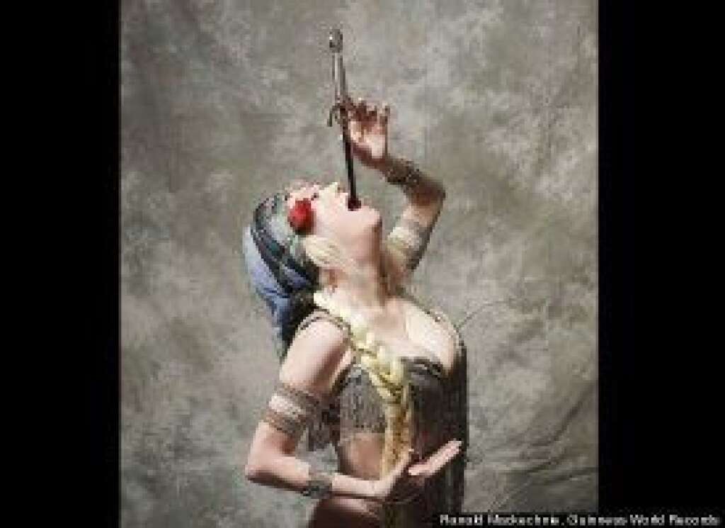 - Natasha Verushka swallowed a 22.83-inch sword on Sword Swallowers Awareness Day, on Feb. 28, 2009. On Nov. 18, 2010 -- Guinness World Records Day -- an attempt was made to set the record for the longest sword swallowed on live TV.