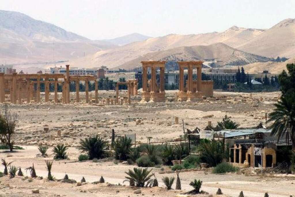 Mideast Syria Palmyra - This photo released on Sunday, May 17, 2015, by the Syrian official news agency SANA, shows the general view of the ancient Roman city of Palmyra, northeast of Damascus, Syria. A Syrian official said on Sunday that the situation is "fully under control" in Palmyra despite breaches by Islamic State militants who pushed into the historic town a day earlier. (SANA via AP)