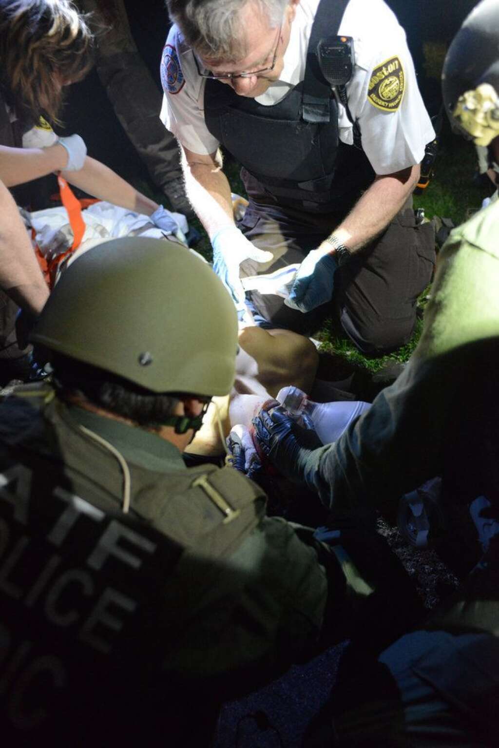New Boston Bombing Arrest Photos - <a href="http://www.bostonmagazine.com/news/article/2013/08/27/dzhokhar-tsarnaev-manhunt-photos/1/">Dzhokhar Tsarnaev</a>. (Sean Murphy / Massachusetts State Police)