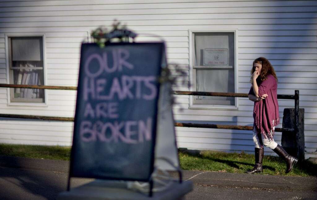 Sandy Hook Elementary School Shooting - Shop owner Tamara Doherty paces outside her store just down the road from Sandy Hook Elementary School, Saturday, Dec. 15, 2012, in Newtown, Conn. The massacre of 26 children and adults at the school elicited horror and soul-searching around the world even as it raised more basic questions about why the gunman, 20-year-old Adam Lanza, would have been driven to such a crime and how he chose his victims. (AP Photo/David Goldman)
