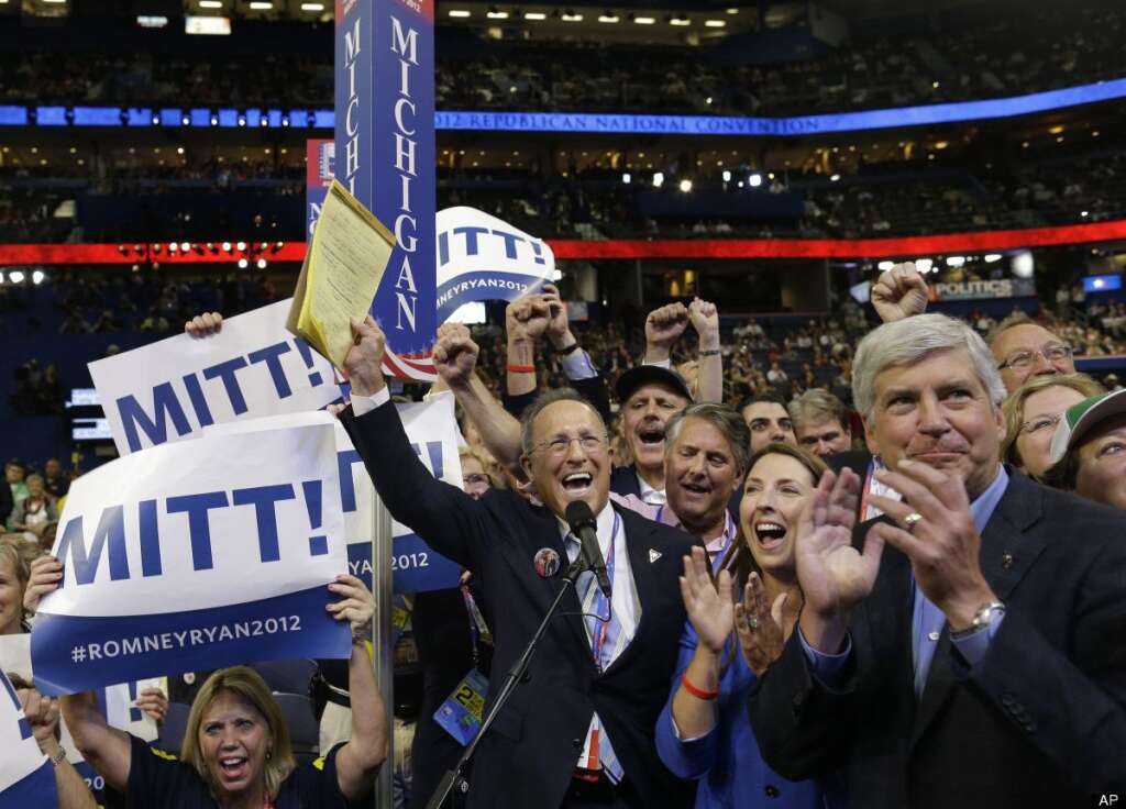 Scott Romney, Rick Snyder. - Michigan delegate Scott Romney, center with a note pad, and the rest of Michigan delegates react at the Republican National Convention in Tampa, Fla., on Tuesday, Aug. 28, 2012. At right is Michigan Gov. Rick Snyder. (AP Photo/Charles Dharapak)