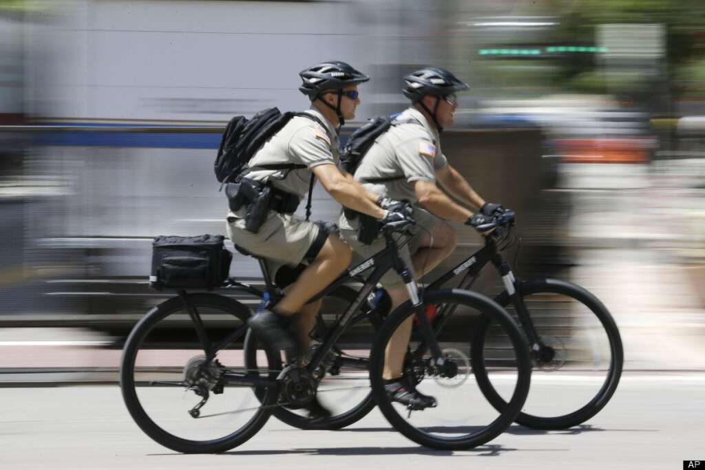 Police officers patrol, Tuesday, Aug. 28, 2012, in Tampa, Fla. Here