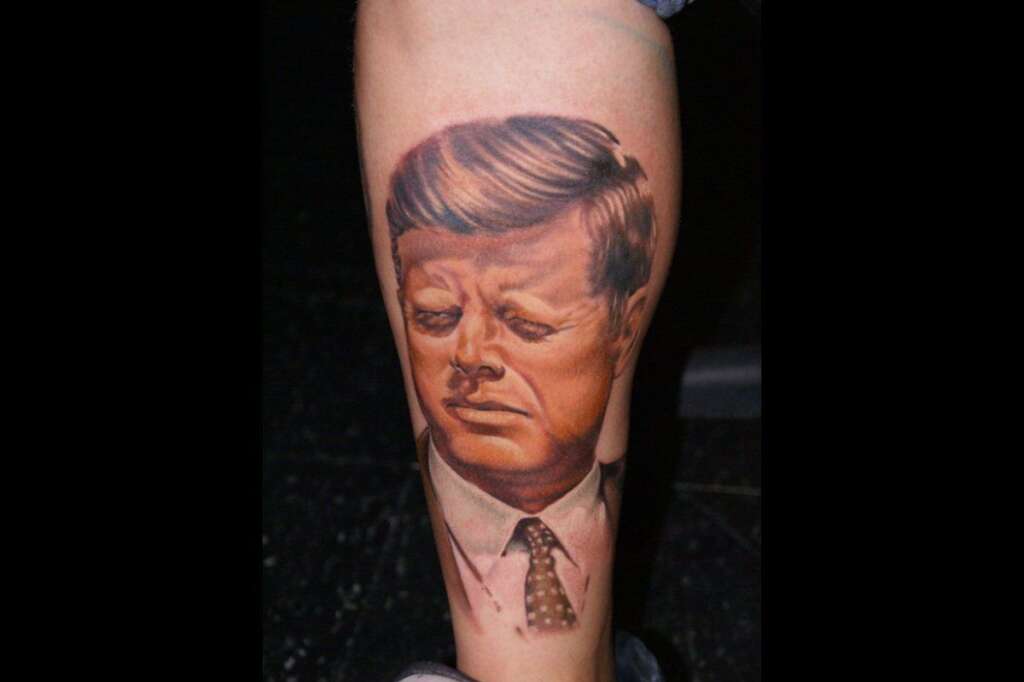 JFK, Part I - "Ich bin ein tattoo."    <em><a href="http://lelkola.deviantart.com/journal/Tattoos-for-life-216746012#/d1xarbc" target="_hplink">(source)</a></em>