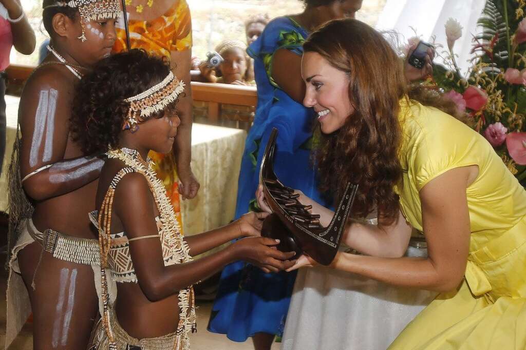 The Duke And Duchess Of Cambridge Diamond Jubilee Tour - Day 7 - HONIARA, SOLOMON ISLANDS - SEPTEMBER 17:  Catherine, Duchess of Cambridge meets a young well-wisher as she attends a Women's Reception at the Leaf House, Commonwealth Youth South Pacific Centre on day 7 of their Diamond Jubilee Tour, on September 17, 2012 in Honiara, Solomon Islands. Prince William, Duke of Cambridge and Catherine, Duchess of Cambridge arrived in the Solomon Islands as the first stop of the Pacific leg of their nine day Diamond Jubilee Tour of the Far East and South Pacific.  (Photo by Danny Lawson - Pool/Getty Images)