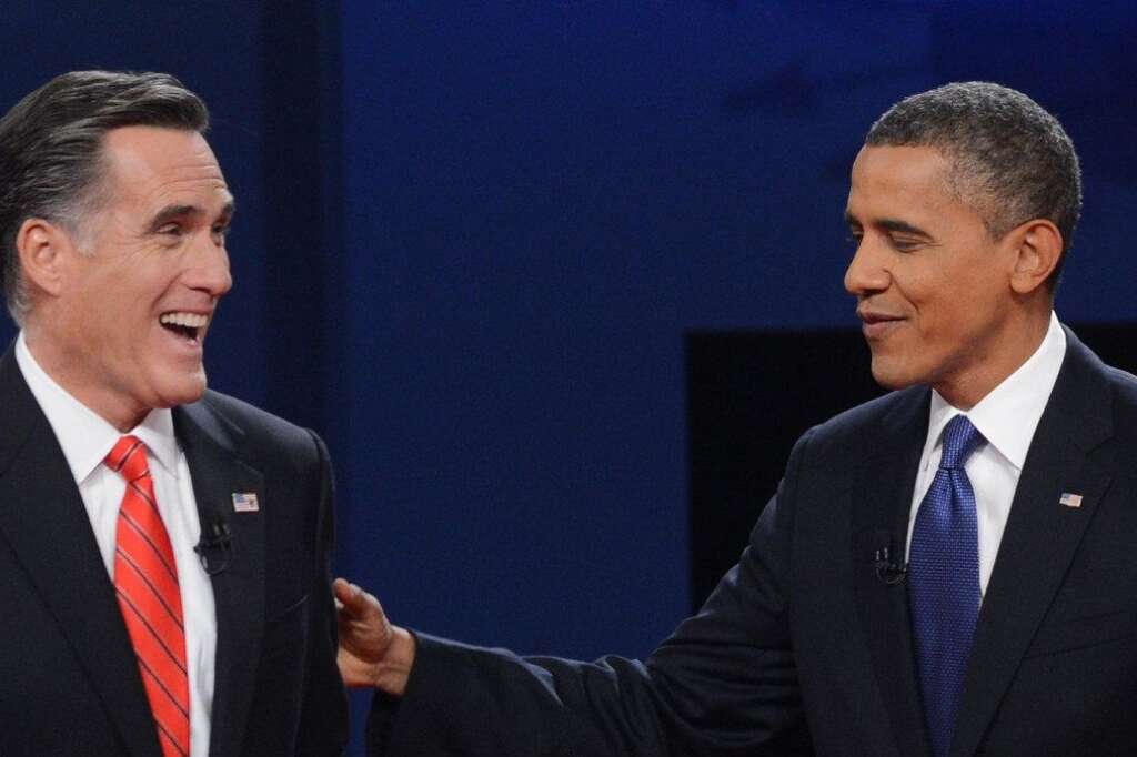US-VOTE-2012-DEBATE - US President Barack Obama (R) greets Republican presidential candidate Mitt Romney (L) following the first presidential debate at Magness Arena at the University of Denver in Denver, Colorado, October 3, 2012. After hundreds of campaign stops, $500 million in mostly negative ads and countless tit-for-tat attacks,  Obama and Romney went head-to-head in their debut debate.    AFP PHOTO / Saul LOEB        (Photo credit should read SAUL LOEB/AFP/GettyImages)