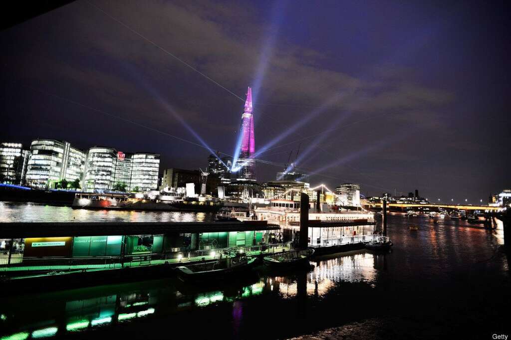 The Shard, Europe's Largest Building Is Unveiled After Completion Of It's Exterior - LONDON, ENGLAND - JULY 05:  The Shard is seen lit up during a laser light show from Tower Millennium Pier on July 5, 2012 in London, England. The European Union's highest building designed by Italian architect Renzo Piano, stands at 310 meters tall situated on London's Southbank is formally inaugurated this evening at 10pm with a laser show that will also be streamed live on the internet.  (Photo by Bethany Clarke/Getty Images)